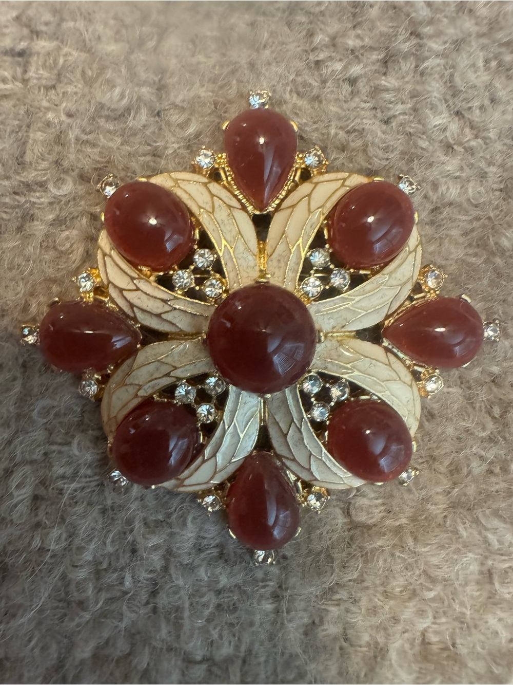 Elegant Gold-Tone Floral Brooch with Deep Red Cabochons